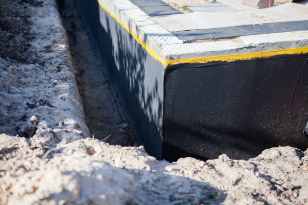Professional Waterproofing technician working in Lenoir City, TN